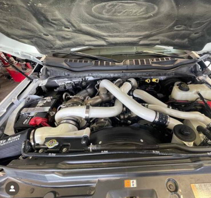 6.7 Powerstroke turbo setup in engine bay showing upgraded turbo configuration